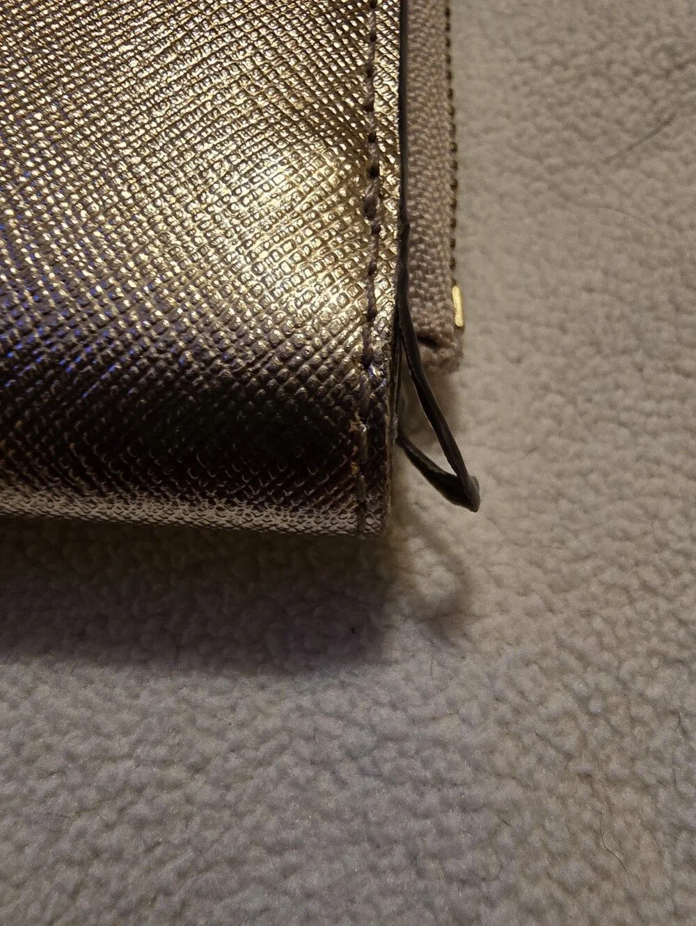 Kate Spade New York Staci small zip-around bifold wallet featuring a glittery ro